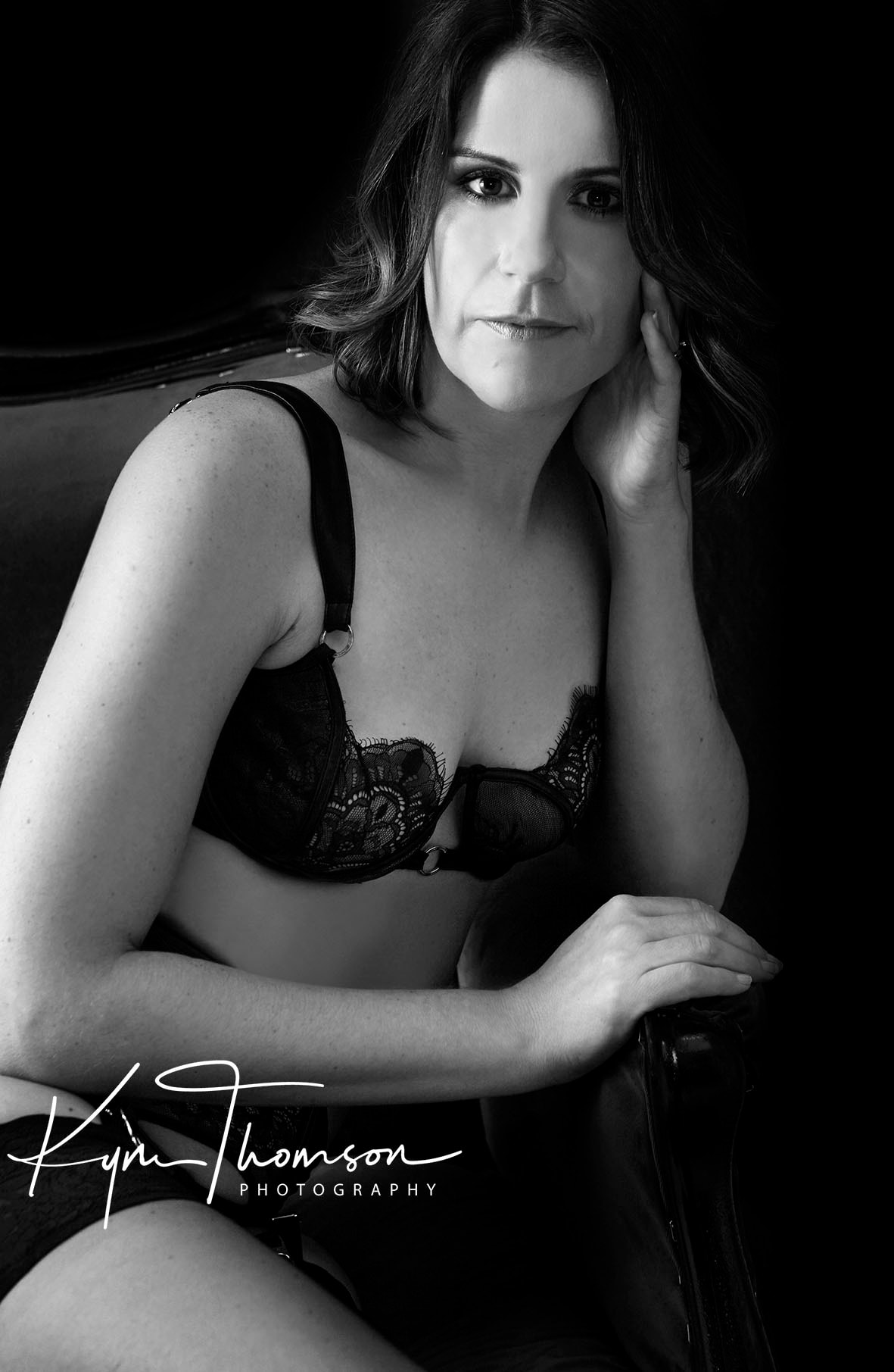 Elegant boudoir portrait moody studio